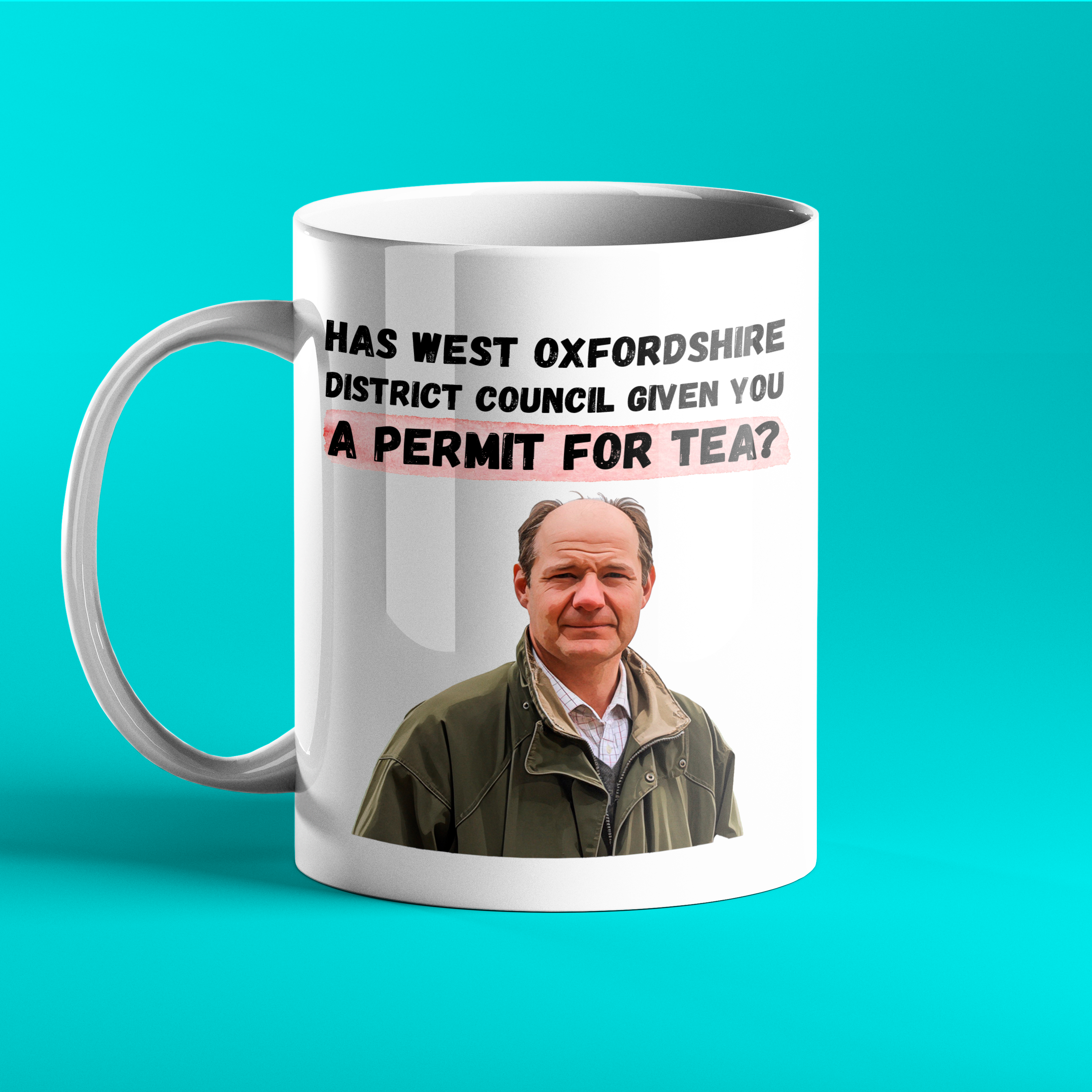White ceramic mug featuring a photo of Charlie Ireland from Clarkson’s Farm and the quote: “Has West Oxfordshire District Council given you a permit for tea?” in bold black and red text. Set against a bright turquoise background.